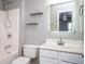 Bright bathroom featuring a shower and tub combination, plus a large, well-lit mirror at 402 Iona Abbey Se Ct, Smyrna, GA 30082