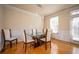 Dining room with hardwood floors, chair rail detail, and modern chandelier at 402 Iona Abbey Se Ct, Smyrna, GA 30082