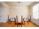 Dining room with neutral colors, large table, chandelier and hardwood floors at 402 Iona Abbey Se Ct, Smyrna, GA 30082