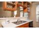 Kitchen with stainless steel appliances, wood cabinets, and a view of the outdoors at 402 Iona Abbey Se Ct, Smyrna, GA 30082