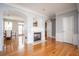 Bright living room featuring a fireplace, hardwood floors, and white trim at 402 Iona Abbey Se Ct, Smyrna, GA 30082