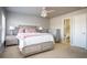 Comfortable main bedroom with a ceiling fan and ensuite bathroom access at 402 Iona Abbey Se Ct, Smyrna, GA 30082