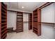 Large walk-in closet with custom organizers and plenty of room for clothes and accessories at 402 Iona Abbey Se Ct, Smyrna, GA 30082