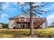 Expansive two story back deck with ample seating space and stairs leading to the lawn at 7881 Wilkerson Ln, Palmetto, GA 30268