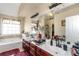 Bright bathroom with a double sink vanity and a soaking tub beneath a window, offering a relaxing ambiance at 7881 Wilkerson Ln, Palmetto, GA 30268