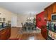 Dining area with hardwood floors and modern chandelier lighting at 7881 Wilkerson Ln, Palmetto, GA 30268