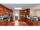 Kitchen featuring dark wood cabinets, stainless appliances and hardwood floors at 7881 Wilkerson Ln, Palmetto, GA 30268