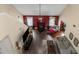 Open-concept living room with hardwood floors, fireplace, fan, neutral walls, and comfortable furniture at 7881 Wilkerson Ln, Palmetto, GA 30268