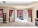 The main bedroom offers french doors to a balcony, carpeted floors, and trey ceiling at 7881 Wilkerson Ln, Palmetto, GA 30268