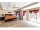 The main bedroom features neutral carpet, a trey ceiling, and french doors to a balcony at 7881 Wilkerson Ln, Palmetto, GA 30268