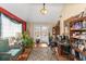 Home office with natural light, desk, and built-in shelving at 7881 Wilkerson Ln, Palmetto, GA 30268