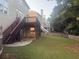 Spacious backyard offers a deck, grassy area and a wooden fence at 1919 Barrett Knoll Nw Cir, Kennesaw, GA 30152