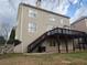 View of the home's backyard and large deck at 1919 Barrett Knoll Nw Cir, Kennesaw, GA 30152