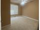 Neutral bedroom showcasing large window, carpet, and neutral colors at 1919 Barrett Knoll Nw Cir, Kennesaw, GA 30152