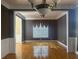 Formal dining room with hardwood floors, crown molding, and an elegant chandelier at 1919 Barrett Knoll Nw Cir, Kennesaw, GA 30152