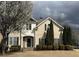 Inviting two-story home featuring a well-maintained lawn, stone accents, and attractive landscaping at 1919 Barrett Knoll Nw Cir, Kennesaw, GA 30152
