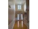 Grand foyer featuring hardwood floors, a staircase, and elegant wainscoting, illuminated by a chandelier at 1919 Barrett Knoll Nw Cir, Kennesaw, GA 30152