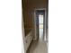 Hallway with sink and vanity leads to bedroom with large window and ceiling fan at 1919 Barrett Knoll Nw Cir, Kennesaw, GA 30152