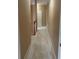 Carpeted hallway offering a view of several rooms and a staircase with wooden railings at 1919 Barrett Knoll Nw Cir, Kennesaw, GA 30152