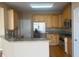 Well-lit kitchen with stainless steel appliances, granite countertops, and wooden cabinetry at 1919 Barrett Knoll Nw Cir, Kennesaw, GA 30152