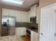 Bright kitchen features white cabinets, stainless steel appliances, and granite countertops at 1919 Barrett Knoll Nw Cir, Kennesaw, GA 30152