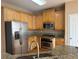 Updated kitchen featuring stainless steel appliances and granite countertops at 1919 Barrett Knoll Nw Cir, Kennesaw, GA 30152