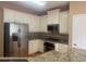 Bright kitchen with white cabinets, granite countertops, and stainless steel appliances at 1919 Barrett Knoll Nw Cir, Kennesaw, GA 30152