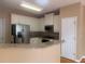 Modern kitchen featuring granite countertops, stainless steel appliances, and white cabinets at 1919 Barrett Knoll Nw Cir, Kennesaw, GA 30152