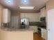 Bright kitchen features white cabinets, stainless steel appliances, and granite countertops at 1919 Barrett Knoll Nw Cir, Kennesaw, GA 30152