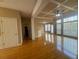 Open living room with hardwood floors, coffered ceiling and lots of natural light at 1919 Barrett Knoll Nw Cir, Kennesaw, GA 30152