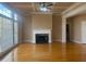 Cozy living room with hardwood floors, fireplace, and many windows at 1919 Barrett Knoll Nw Cir, Kennesaw, GA 30152