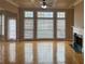 Bright living room with a marble fireplace and hardwood floors at 1919 Barrett Knoll Nw Cir, Kennesaw, GA 30152