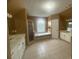 A lavish main bathroom features a glass shower, bathtub, double sinks, and tile floors at 1919 Barrett Knoll Nw Cir, Kennesaw, GA 30152