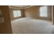 Large main bedroom with two windows offers ample space and natural light at 1919 Barrett Knoll Nw Cir, Kennesaw, GA 30152