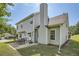 Home's rear view showing the backyard, patio area, and well-manicured lawn at 3370 Flagstone Trce, Ellenwood, GA 30294