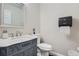 Elegant powder room with marble countertop vanity and modern fixtures at 3370 Flagstone Trce, Ellenwood, GA 30294