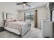 Serene bedroom with plush carpeting, a large window, and a decorative ceiling fan at 3370 Flagstone Trce, Ellenwood, GA 30294