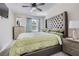Cozy bedroom with comfortable carpet, large window, and elegant headboard at 3370 Flagstone Trce, Ellenwood, GA 30294