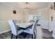 Elegant dining room with a modern chandelier and a marble-topped dining table at 3370 Flagstone Trce, Ellenwood, GA 30294