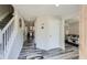 Bright foyer featuring modern flooring, neutral paint, and an open staircase at 3370 Flagstone Trce, Ellenwood, GA 30294