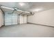 Spacious two car garage featuring two garage door openers and textured ceiling at 3370 Flagstone Trce, Ellenwood, GA 30294