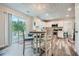 Bright eat-in kitchen featuring white cabinetry and a sliding glass door to the backyard at 3370 Flagstone Trce, Ellenwood, GA 30294