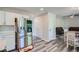 Bright kitchen with stainless steel appliances, white cabinets and a view of the dinette at 3370 Flagstone Trce, Ellenwood, GA 30294