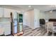 Spacious kitchen with stainless appliances, ample counter space, and stylish gray wood-look flooring at 3370 Flagstone Trce, Ellenwood, GA 30294