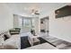 Bright living room with large windows, modern ceiling fan, and stylish decor at 3370 Flagstone Trce, Ellenwood, GA 30294