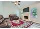Spacious living room featuring a stone fireplace, vaulted ceiling, and comfortable leather sofas at 3370 Flagstone Trce, Ellenwood, GA 30294