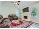 Cozy living room with a fireplace and large windows at 3370 Flagstone Trce, Ellenwood, GA 30294