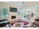 Open-concept living room featuring a fireplace and vaulted ceilings at 3370 Flagstone Trce, Ellenwood, GA 30294