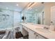 Bright main bathroom featuring a double vanity and walk-in shower with marble tile at 3370 Flagstone Trce, Ellenwood, GA 30294