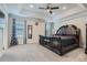 Luxurious main bedroom with a tray ceiling, neutral carpet, and large windows at 3370 Flagstone Trce, Ellenwood, GA 30294